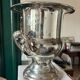 Silver metal champagne bucket.