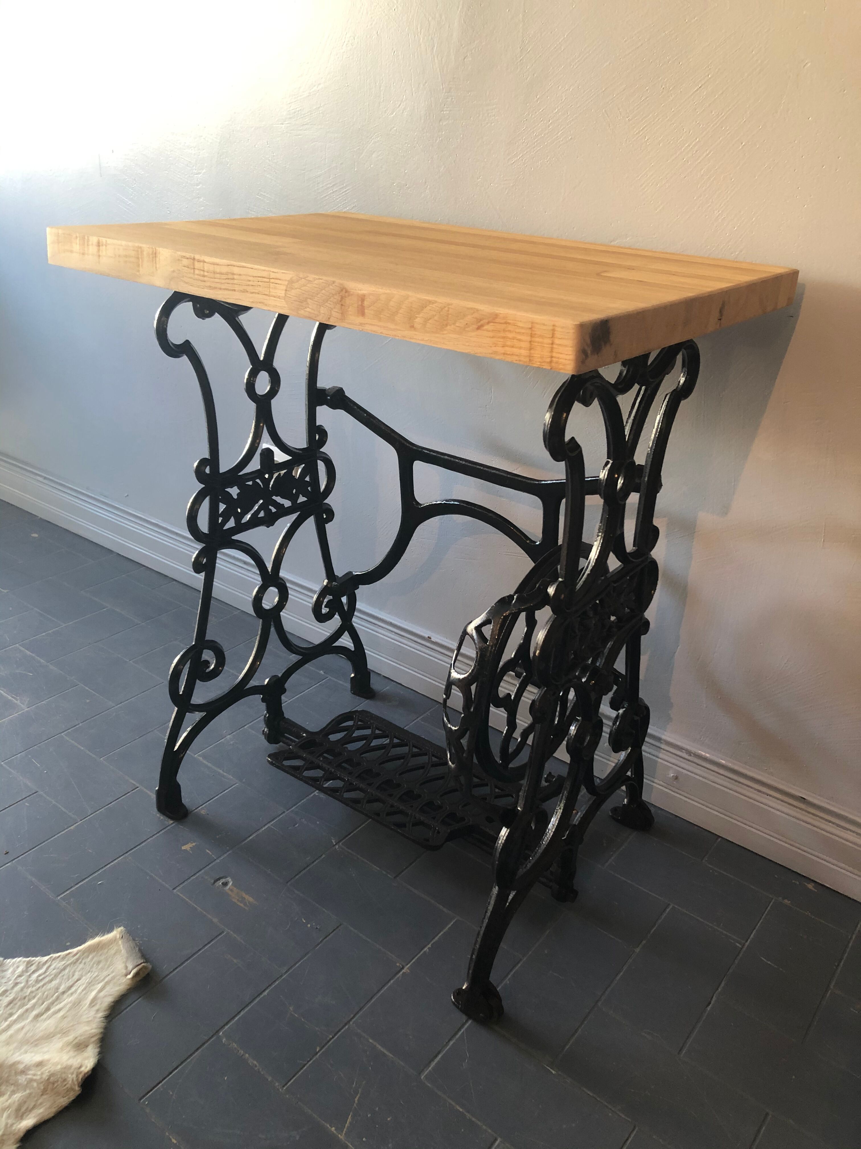 Ancient table, cast iron footing