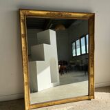 Golden mirror style Restoration decorated with stretched palmettes