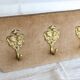 Vintage velvet coat rack with brass hooks