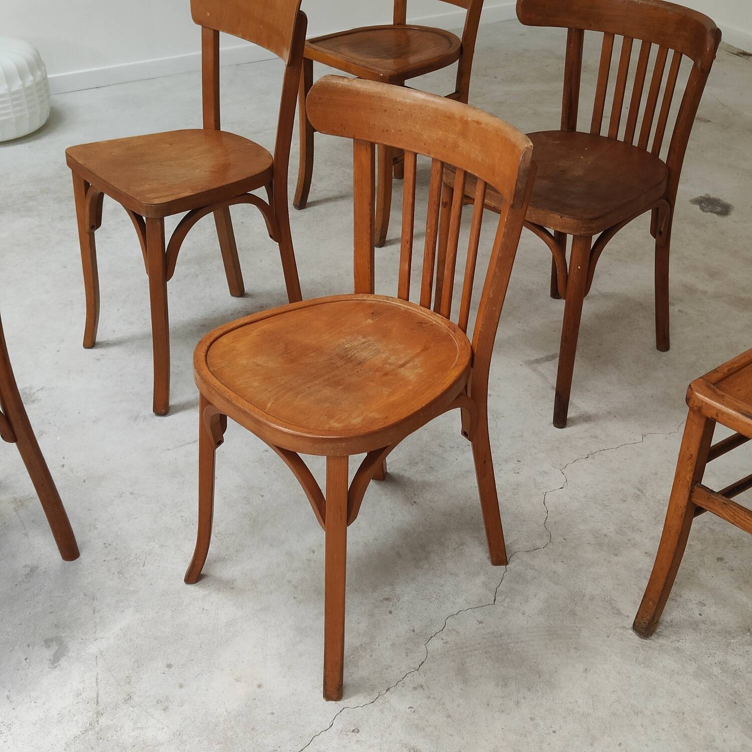 Set of 6 mismatched blond wood bistro chairs