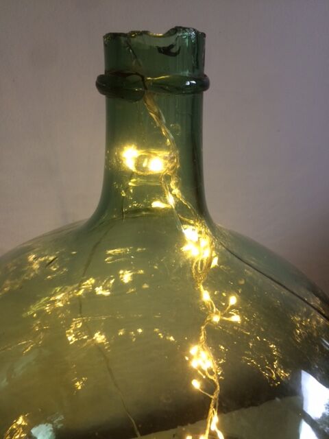 Demijohn old transparent green, estimated capacity around 12 to 15L