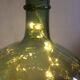 Demijohn old transparent green, estimated capacity around 12 to 15L
