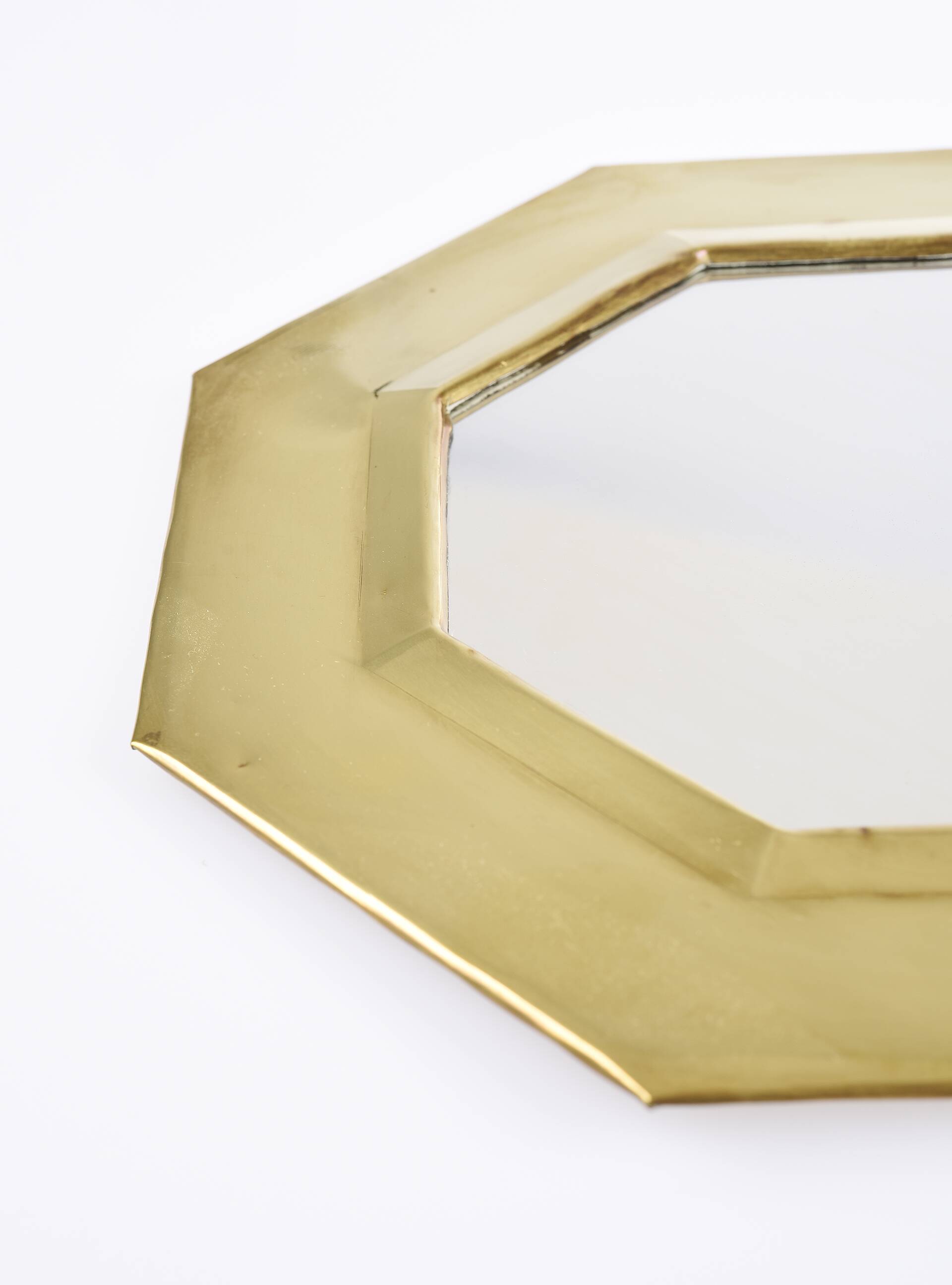 Old golden octagonal mirror, in brass