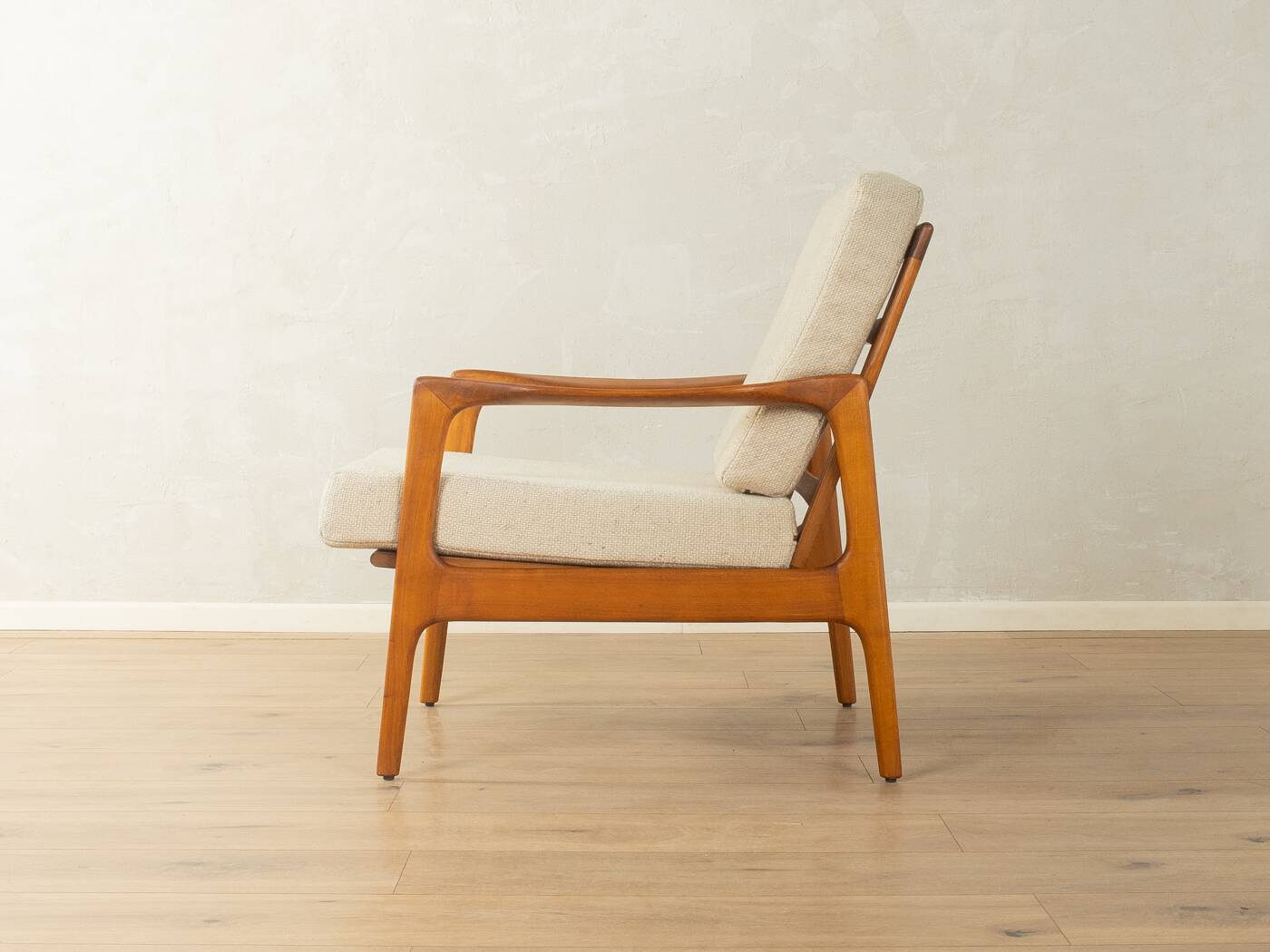 Elegant mid-century armchair from the 1960s with cream-white upholstery