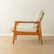 Elegant mid-century armchair from the 1960s with cream-white upholstery