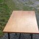 Vintage oak desk with a metallic base from the 1960s.