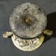 Carved silver bronze vase mounted on marble pedestal