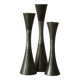 Set of three diabolo-shaped candle holders made of cast steel.