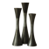 Set of three diabolo-shaped candle holders made of cast steel.