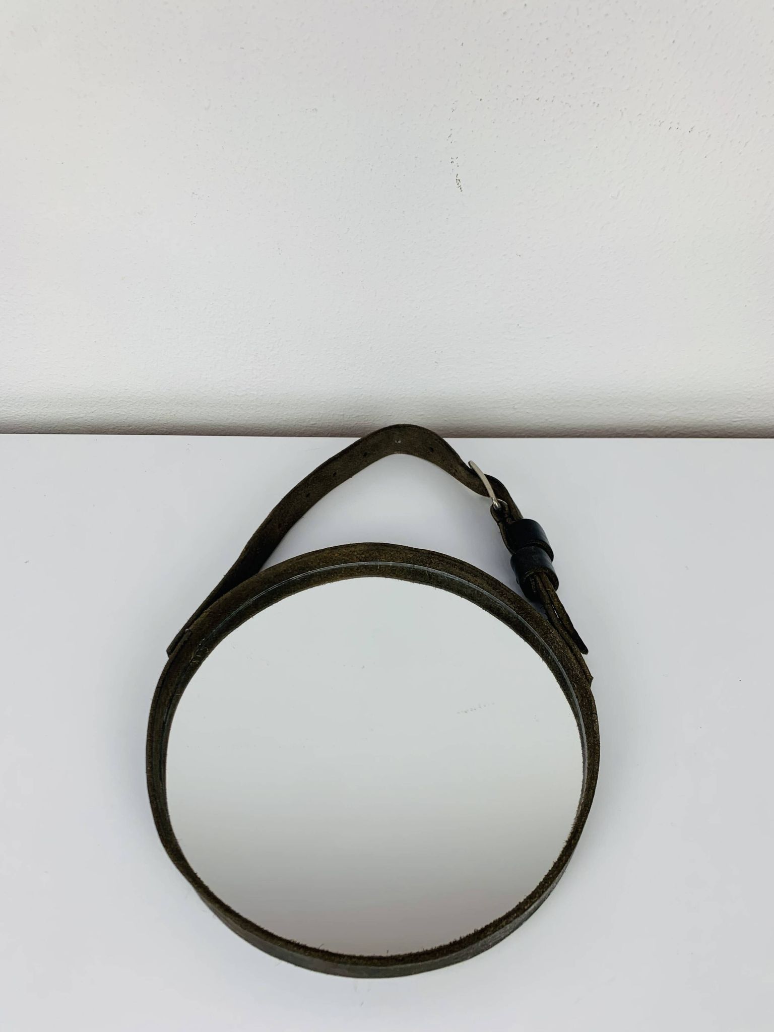 Mirror with handmade leather strapping