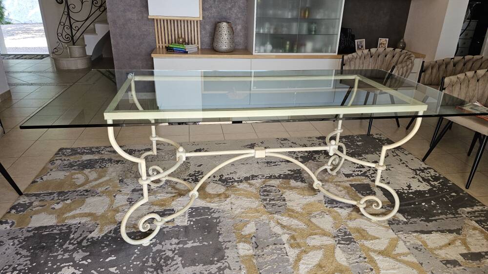 Wrought iron table by Roche Bobois, with a glass top.