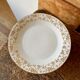 Set of 9 dessert plates in white and gold porcelain