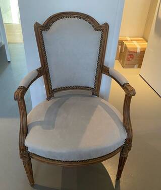 Pair of cabriolet armchairs in light grey and dark grey Louis XV style.