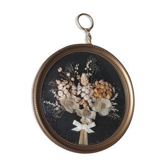 Golden vintage frame of dried flowers