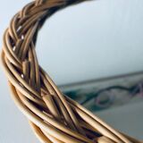 Round mirror in vintage wicker
