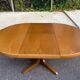Baumann round extendable Scandinavian dining table with central leg, 1960s oak