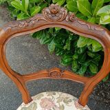 Pair of Louis XV chairs in carved walnut.