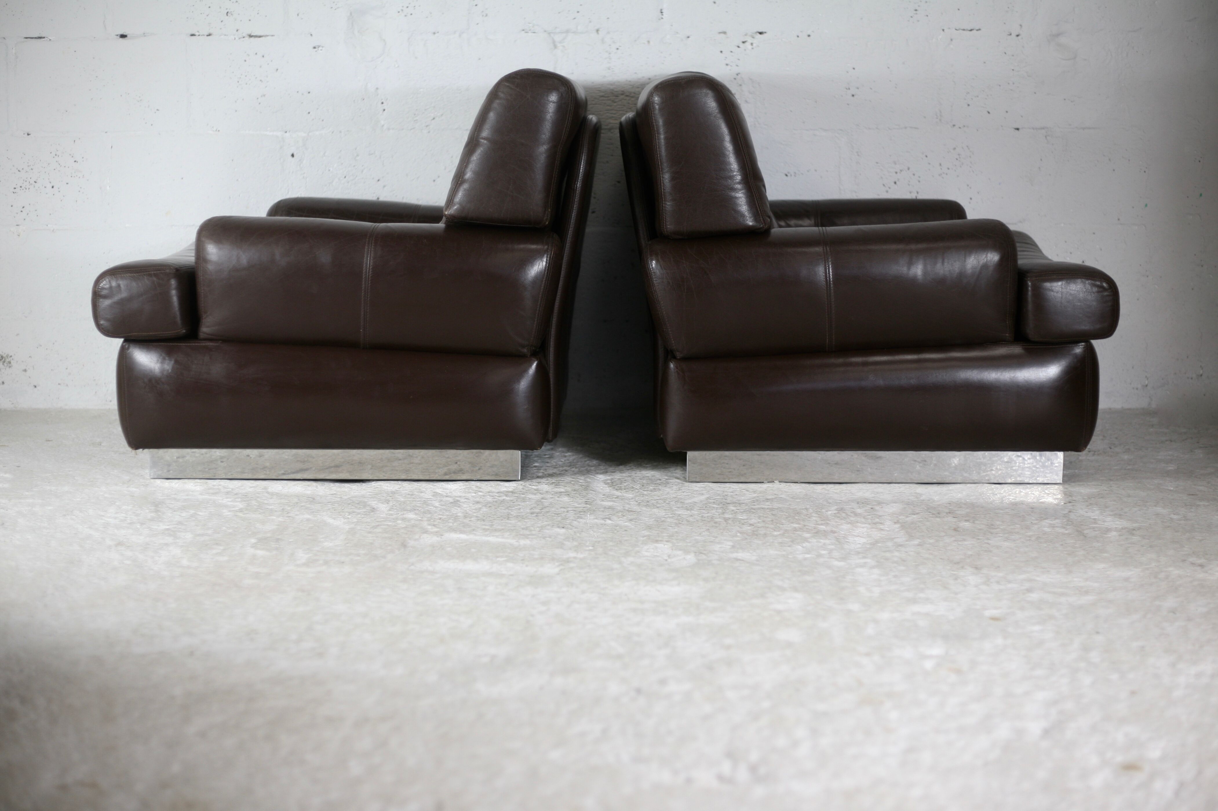 Pair of armchairs brown leather base stainless steel, France, circa 1970