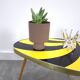 Vintage 1950s black and yellow striped formica table, plant table.