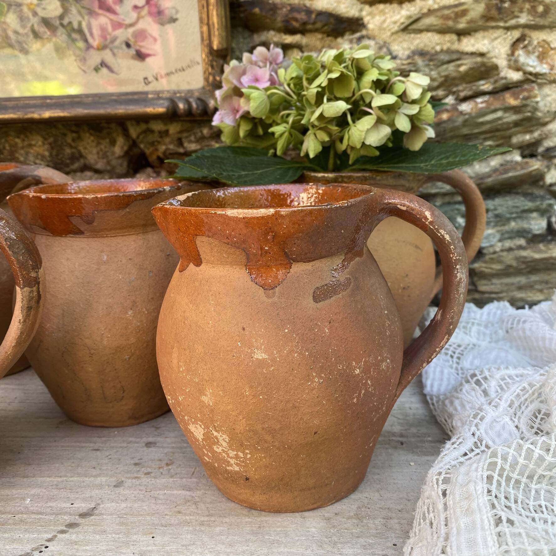 set of terracotta jugs country style
