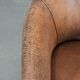 Vintage sheepskin club armchair with character and a beautiful patina