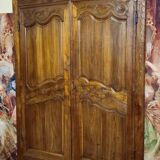 Louis XV period wardrobe façade, solid wood architectural elements, richly carved.