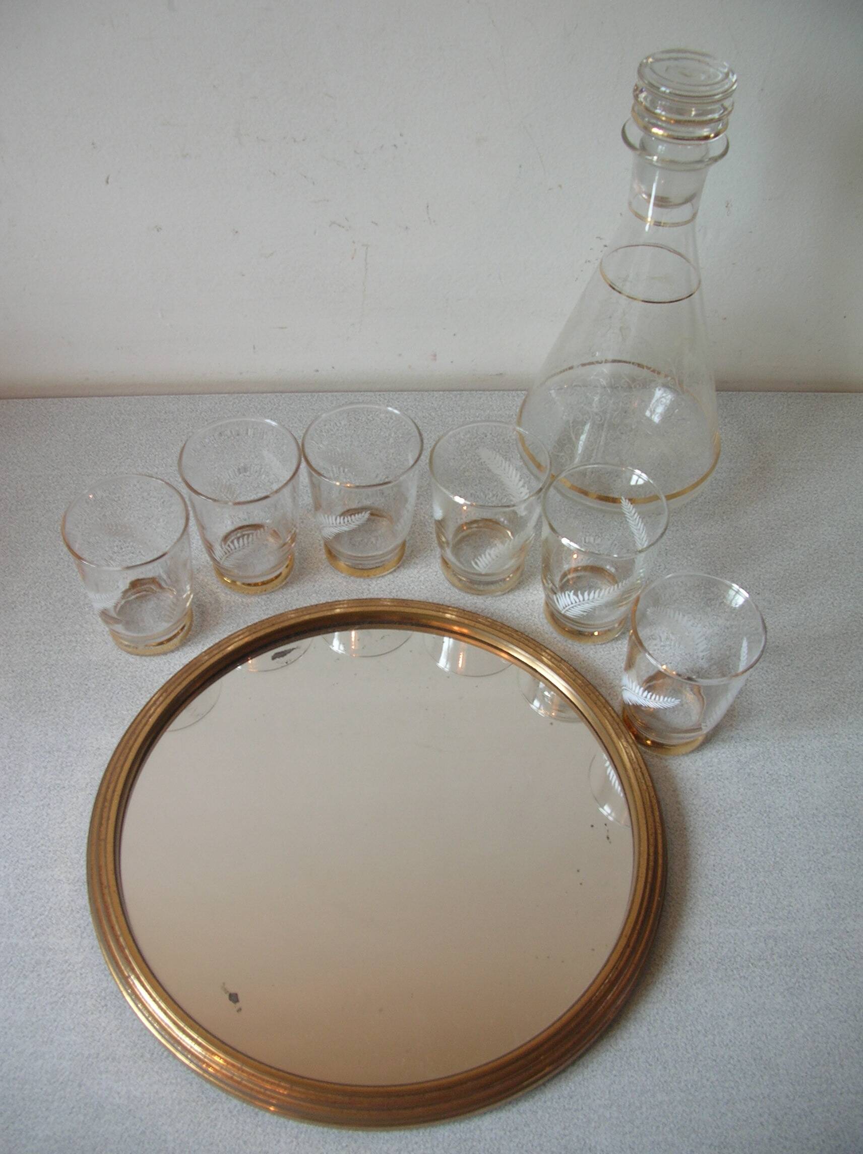 Old glass carafe liquor service with gilding vintage ice mirror tray