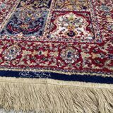 Vintage mechanical Turkish rug with box decoration on a red and navy blue background 139 x 68 cm
