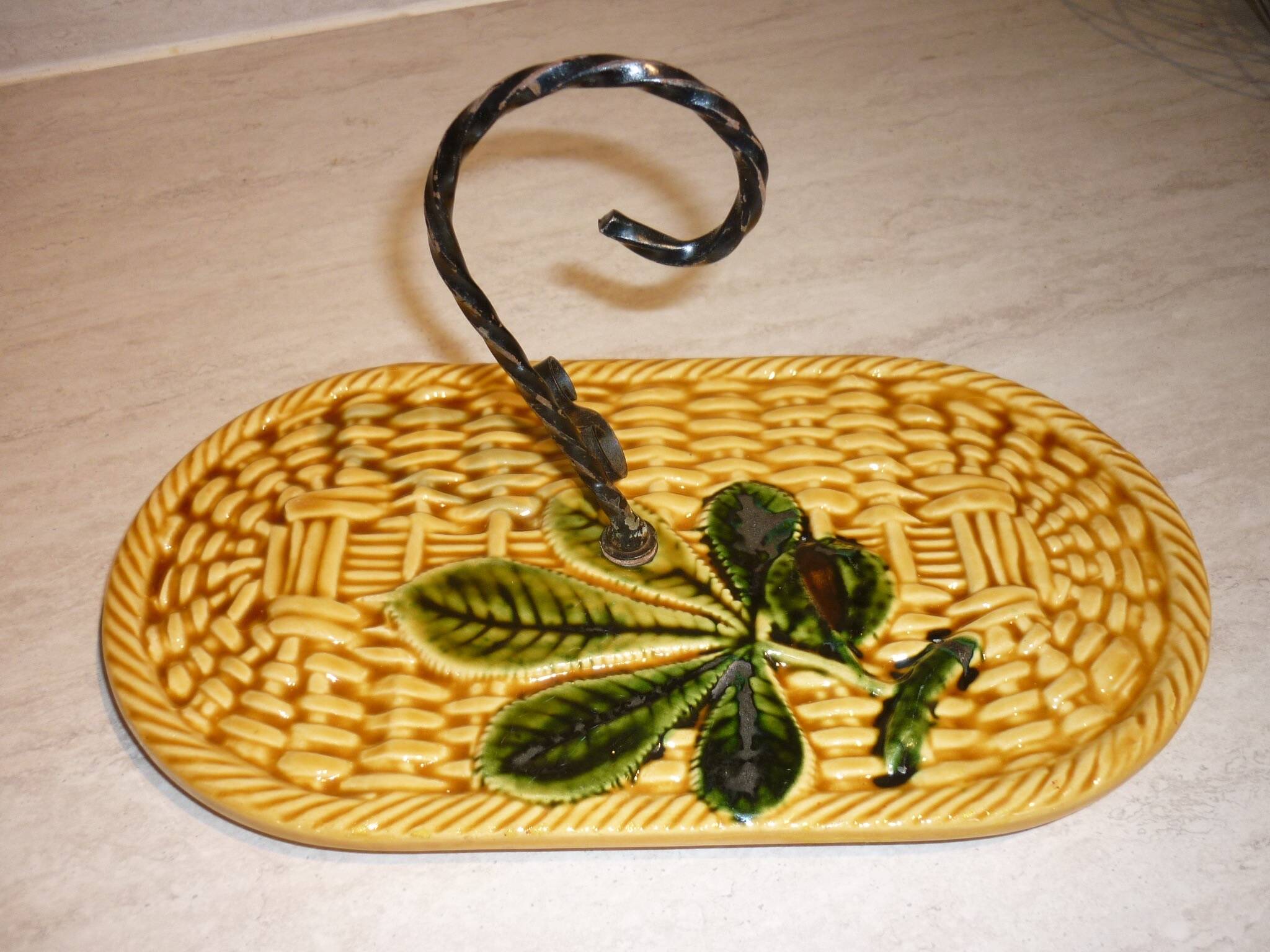 Braided yellow cheese platter and wrought iron
