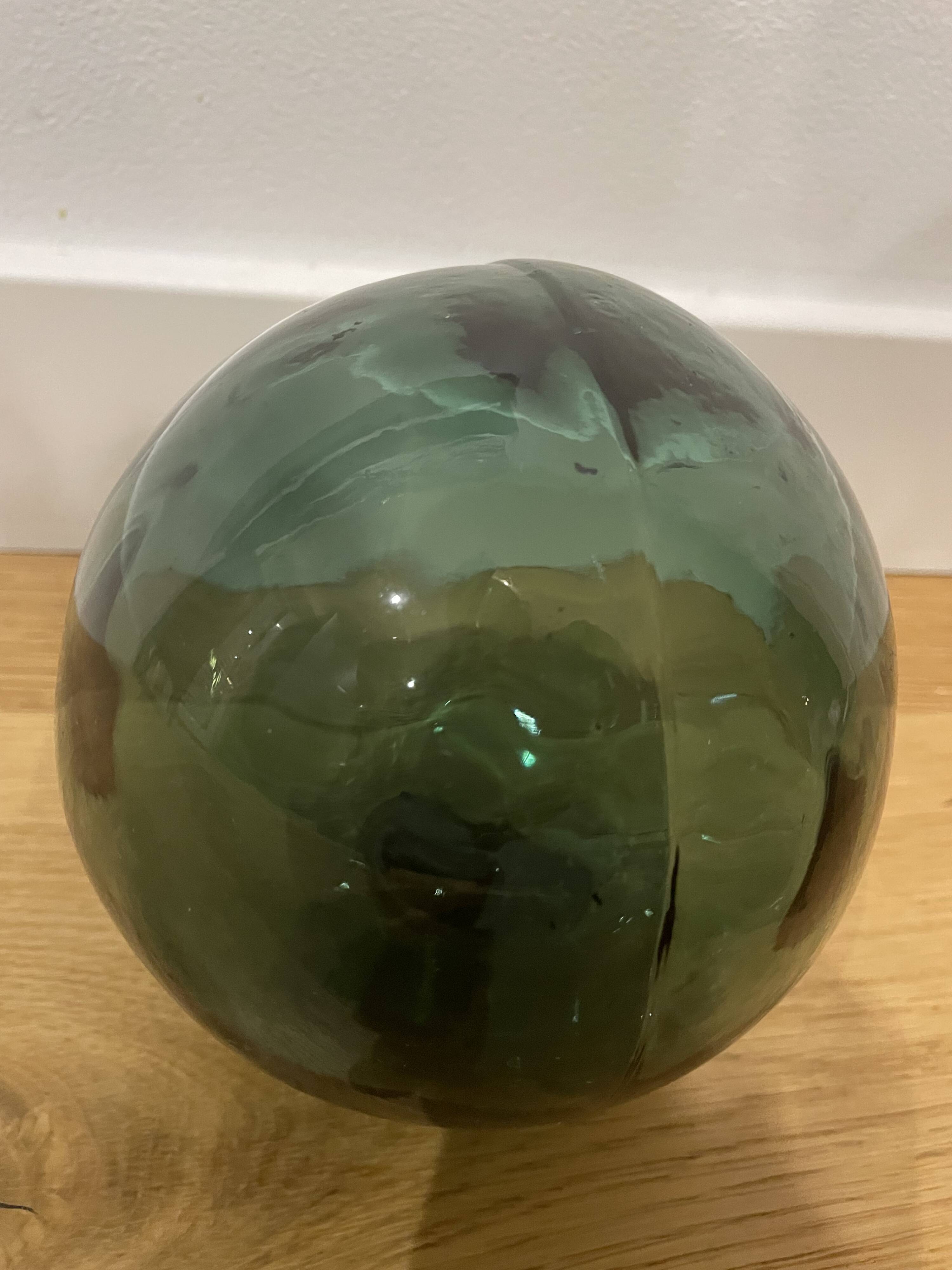 Floating fishing ball in glass