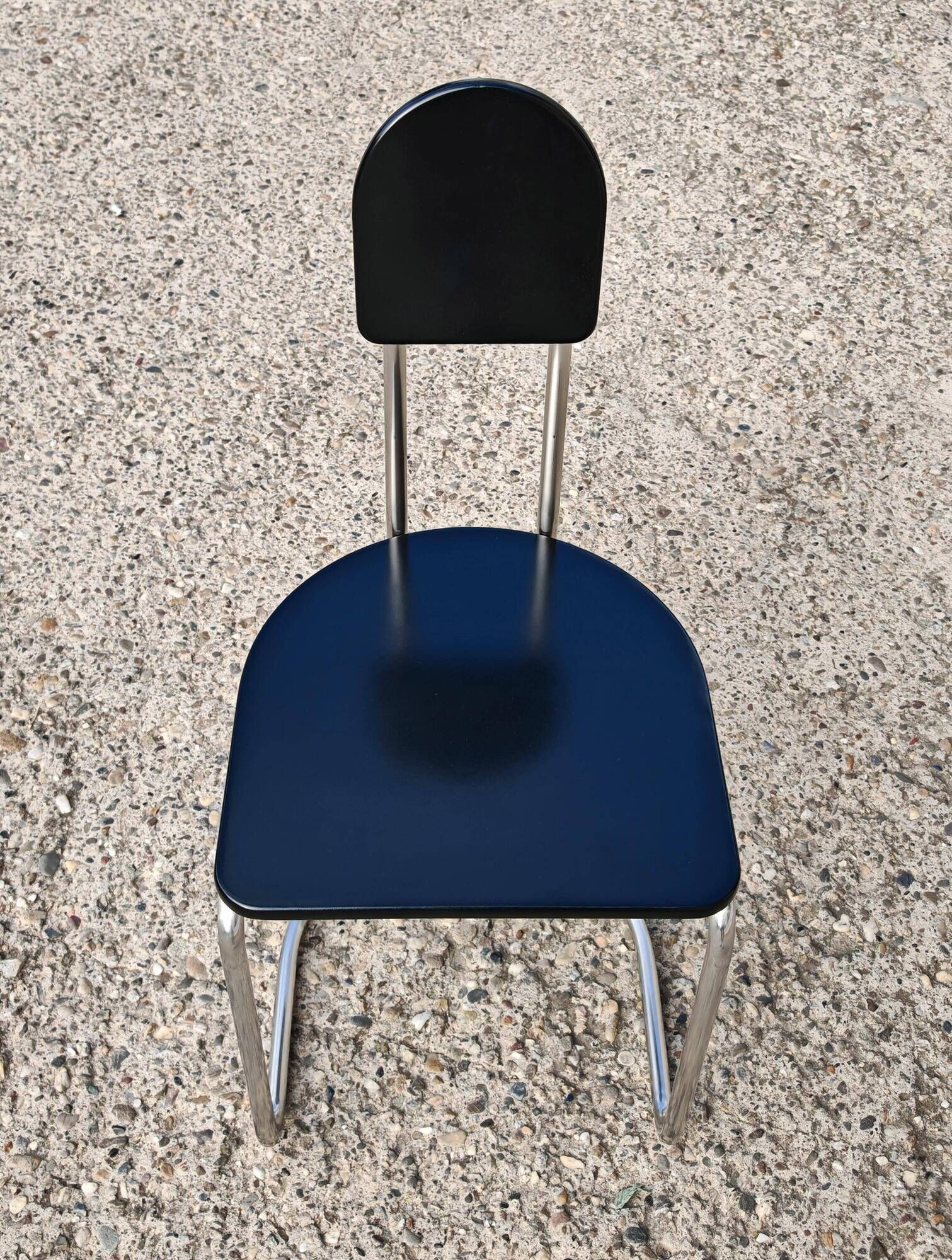 Set of 4 Bauhaus tubular steel chairs with wooden seats.