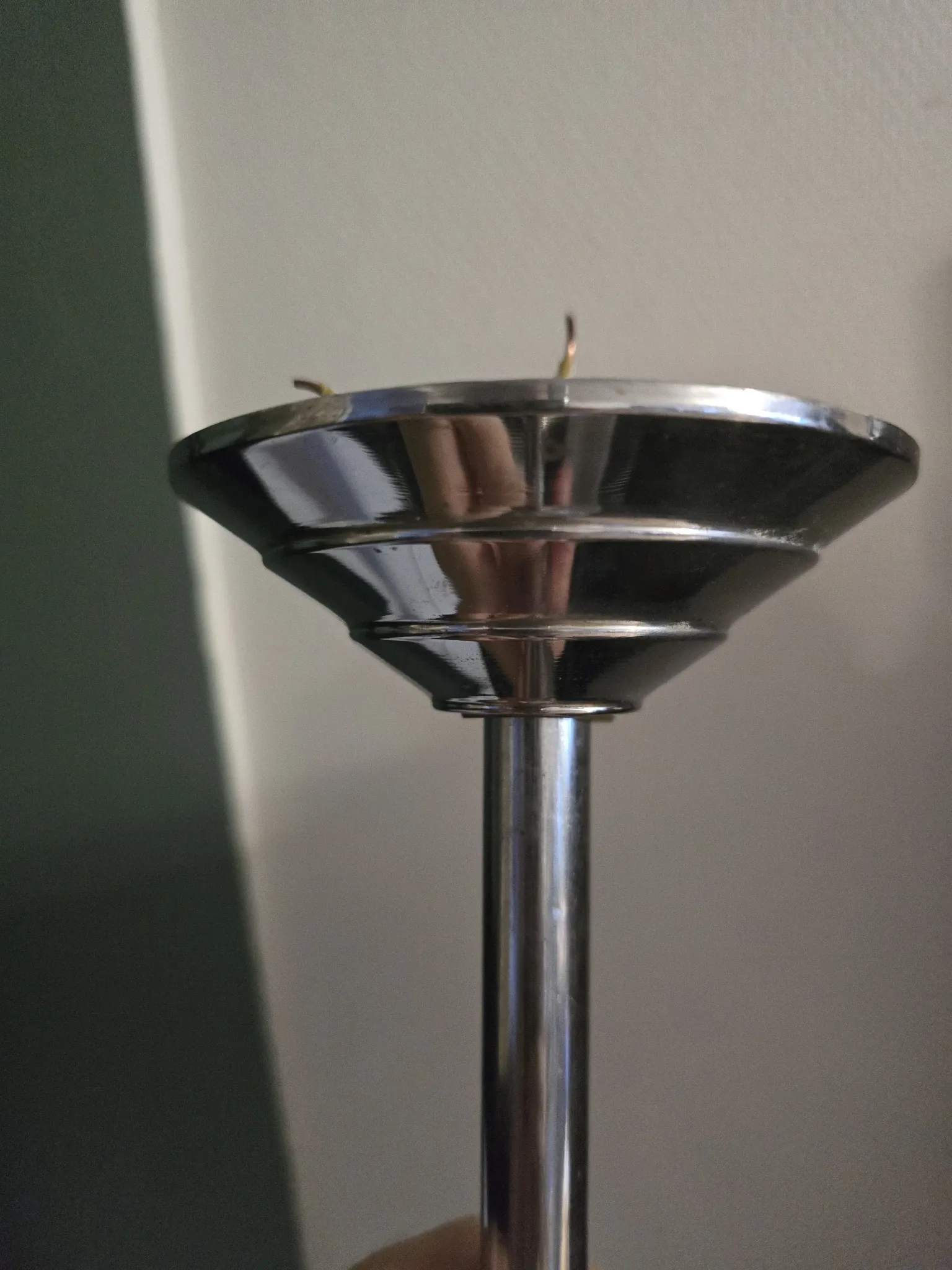 Vintage globe-style holophane on a chrome stem.