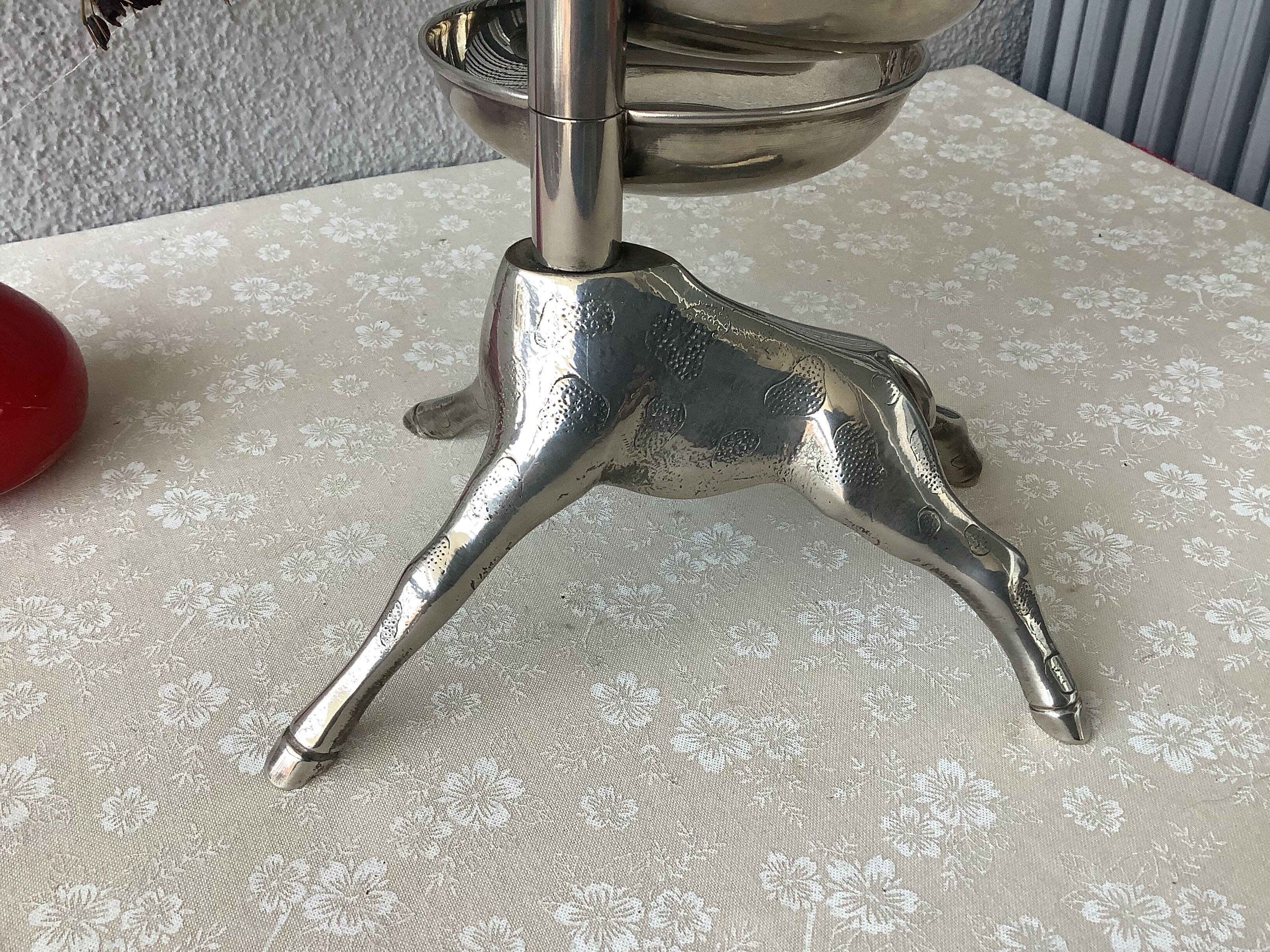 Bronze giraffe and silver metal servant