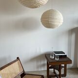 Reclined armchair in canned teak in natural wood