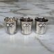 Set of 3 small silver 970 sterling cups with enamelled flags from the 20th century.
