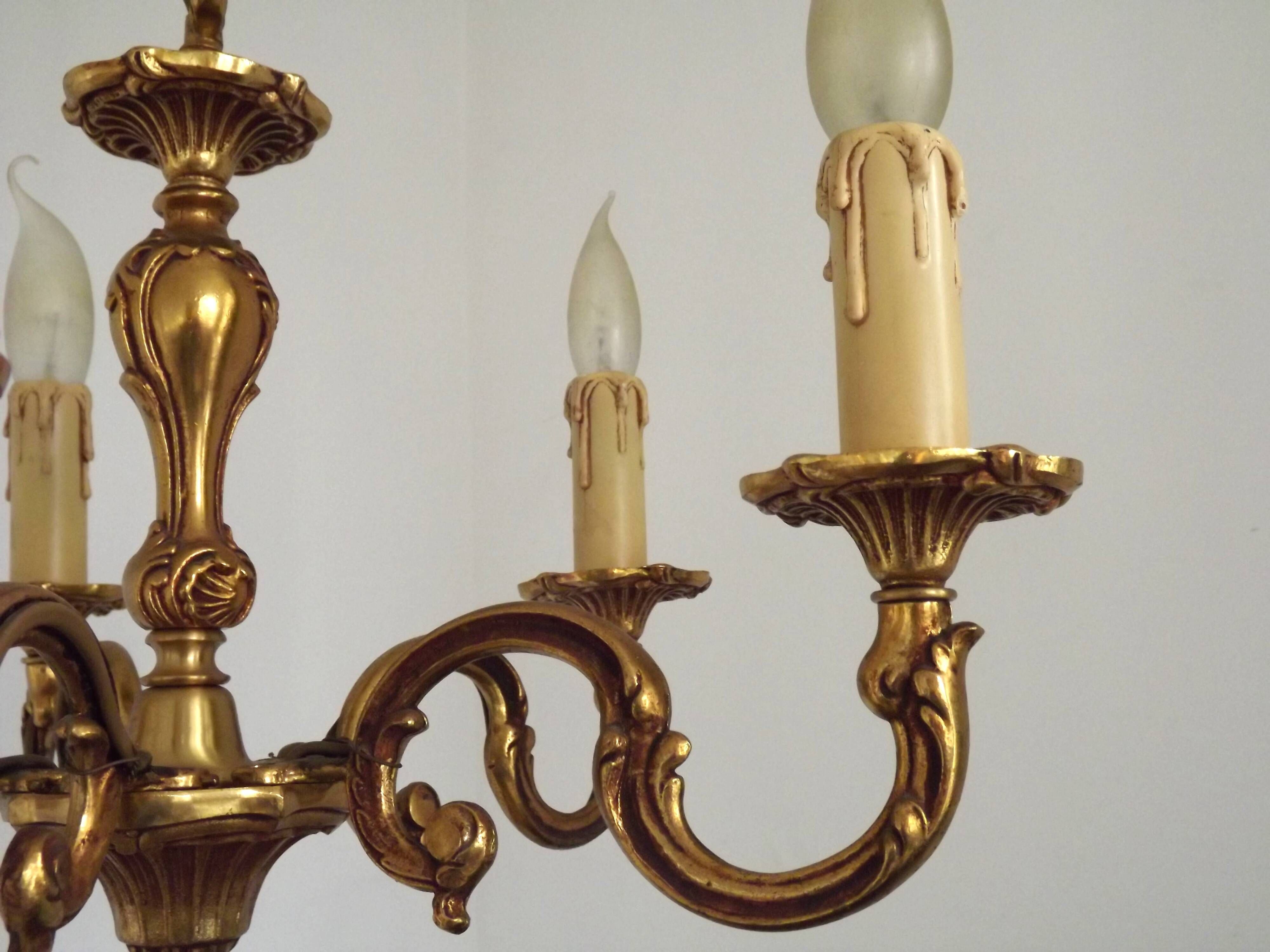 Vintage French traditional style bronze chandelier with 5 lights featuring acanthus leaf details.