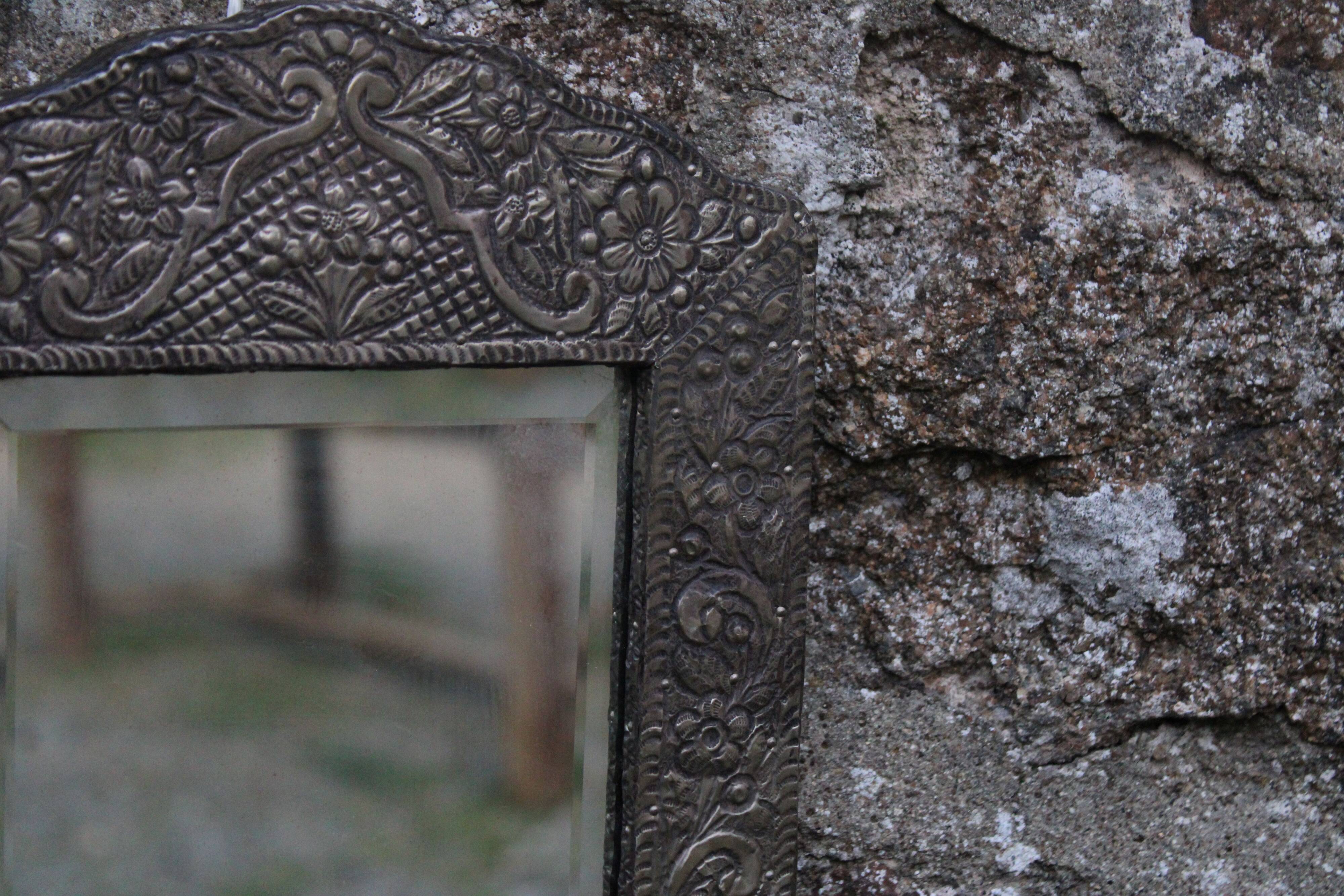 Oriental mirror in chiseled metal – beveled, for placing on a surface or hanging
