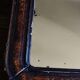 Antique Louis Philippe mirror in black and brown.