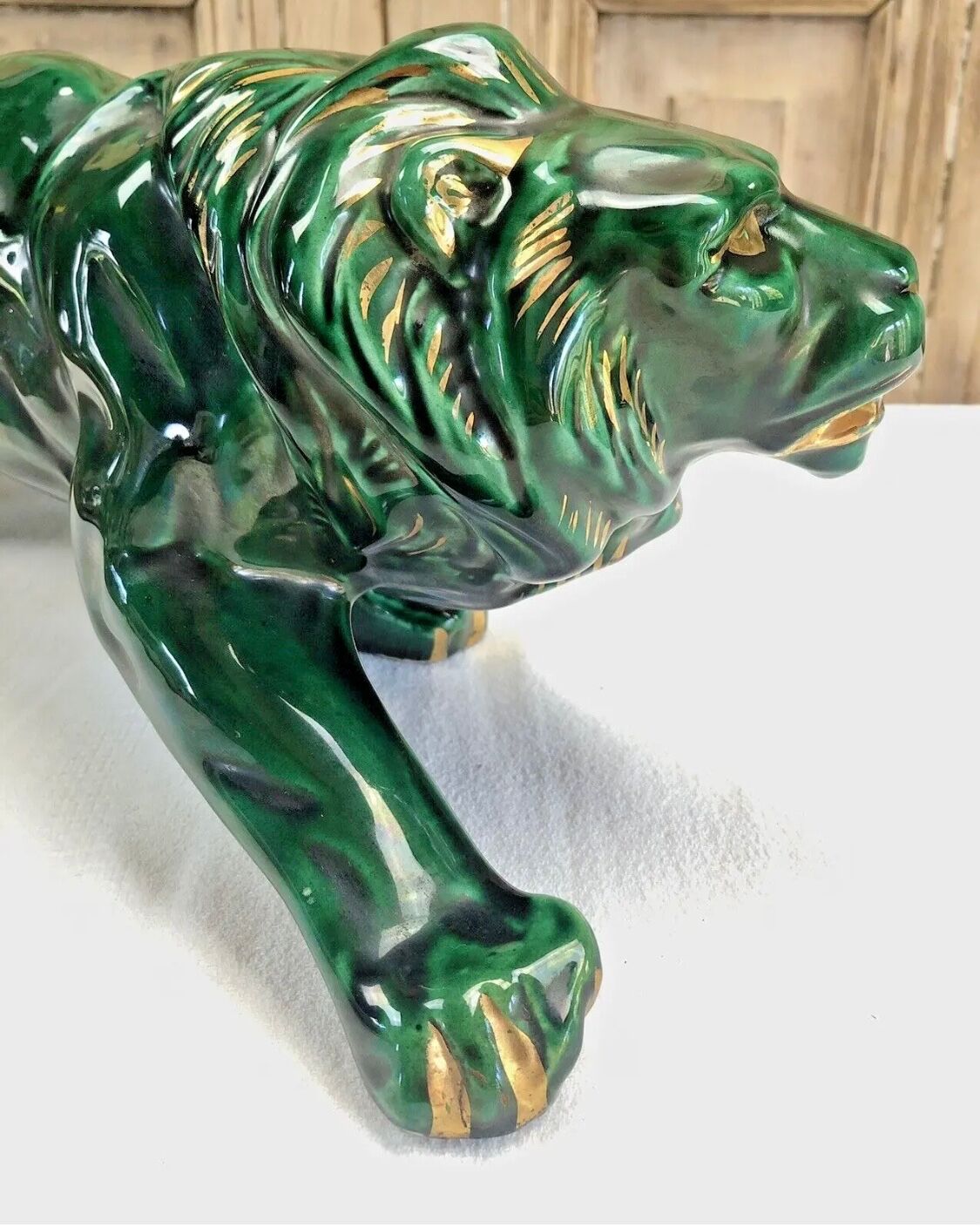 Art Deco lion statue cracked St Clement