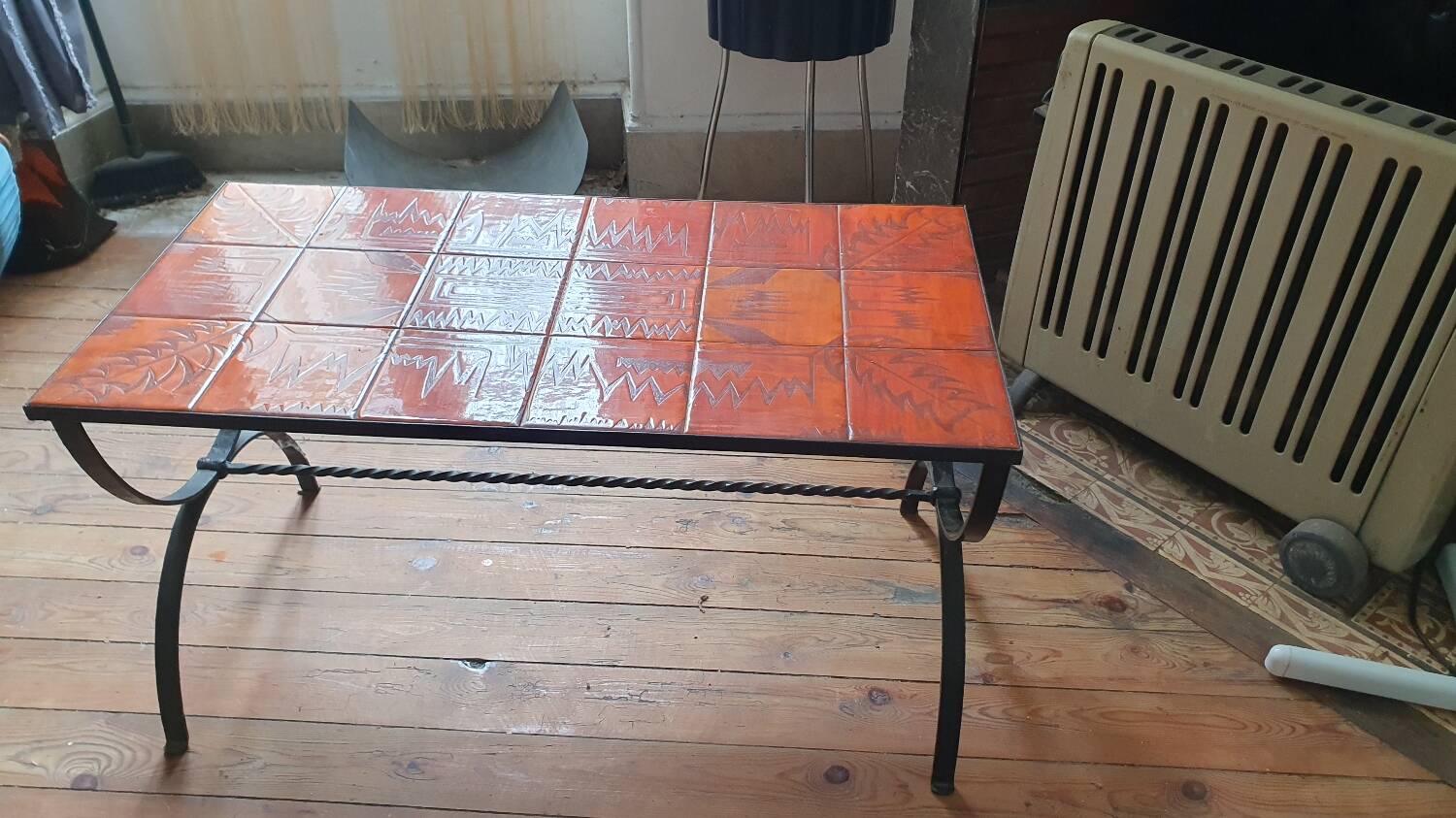 Wrought iron and orange ceramic coffee table