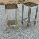 Pair of Hollywood Regency side tables in gold metal and smoked glass.