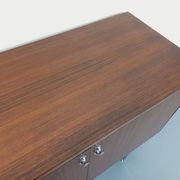 Vintage modernist enfilade in rosewood and chrome metal from the 60s and 70s.