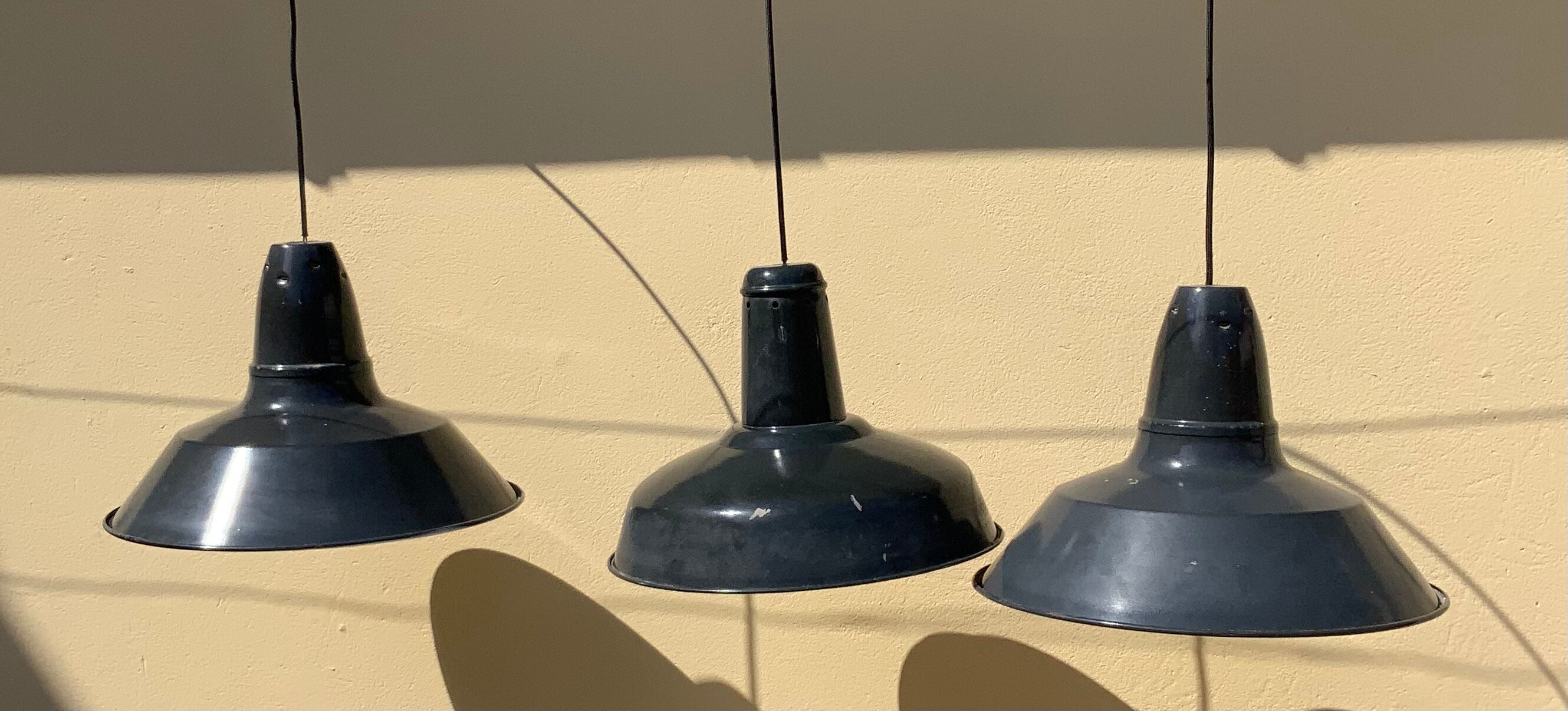 Three industrial suspensions in black and white enamelled sheet metal large format