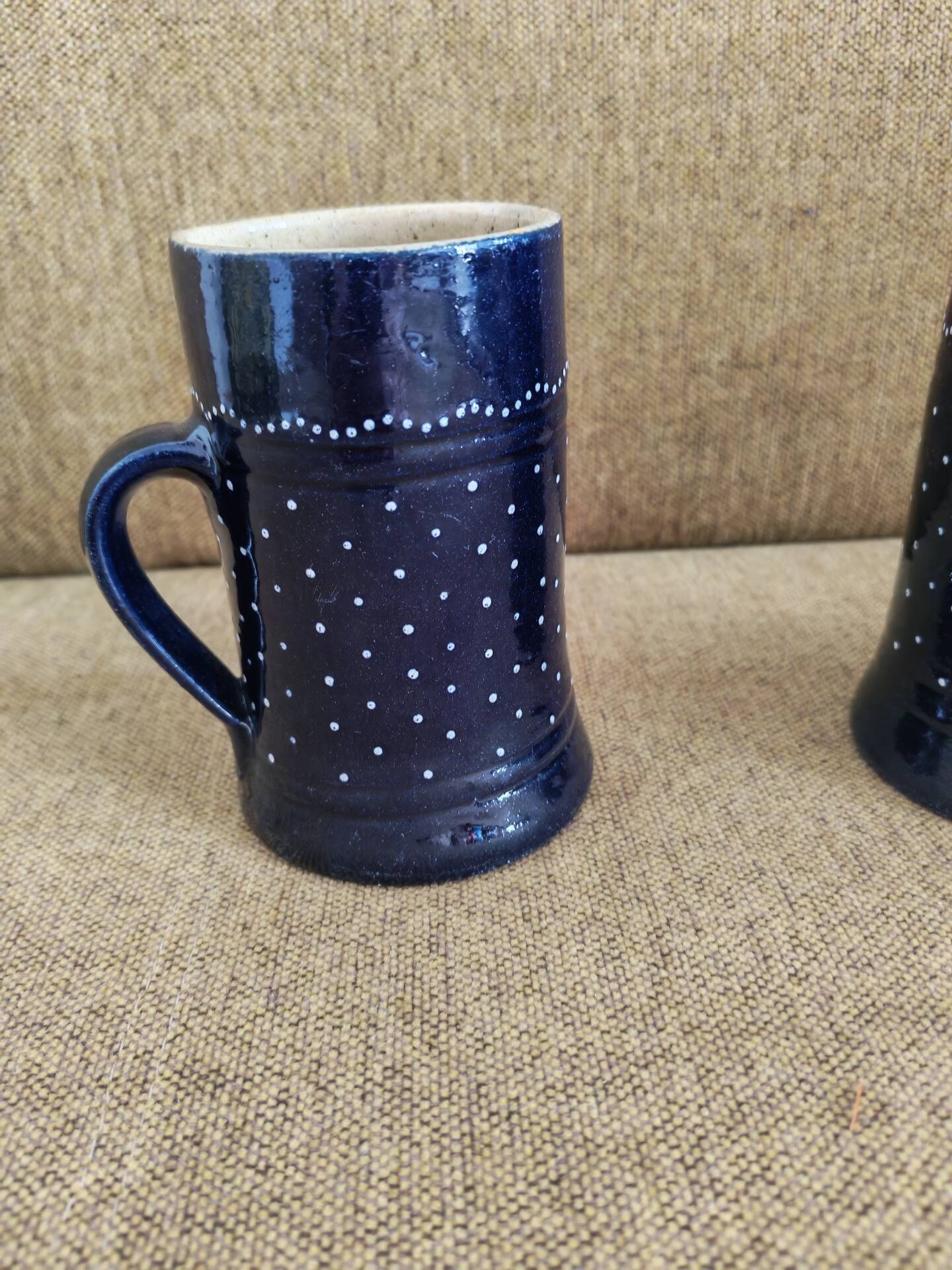 Two vintage mugs in traditional German earthenware.