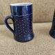Two vintage mugs in traditional German earthenware.