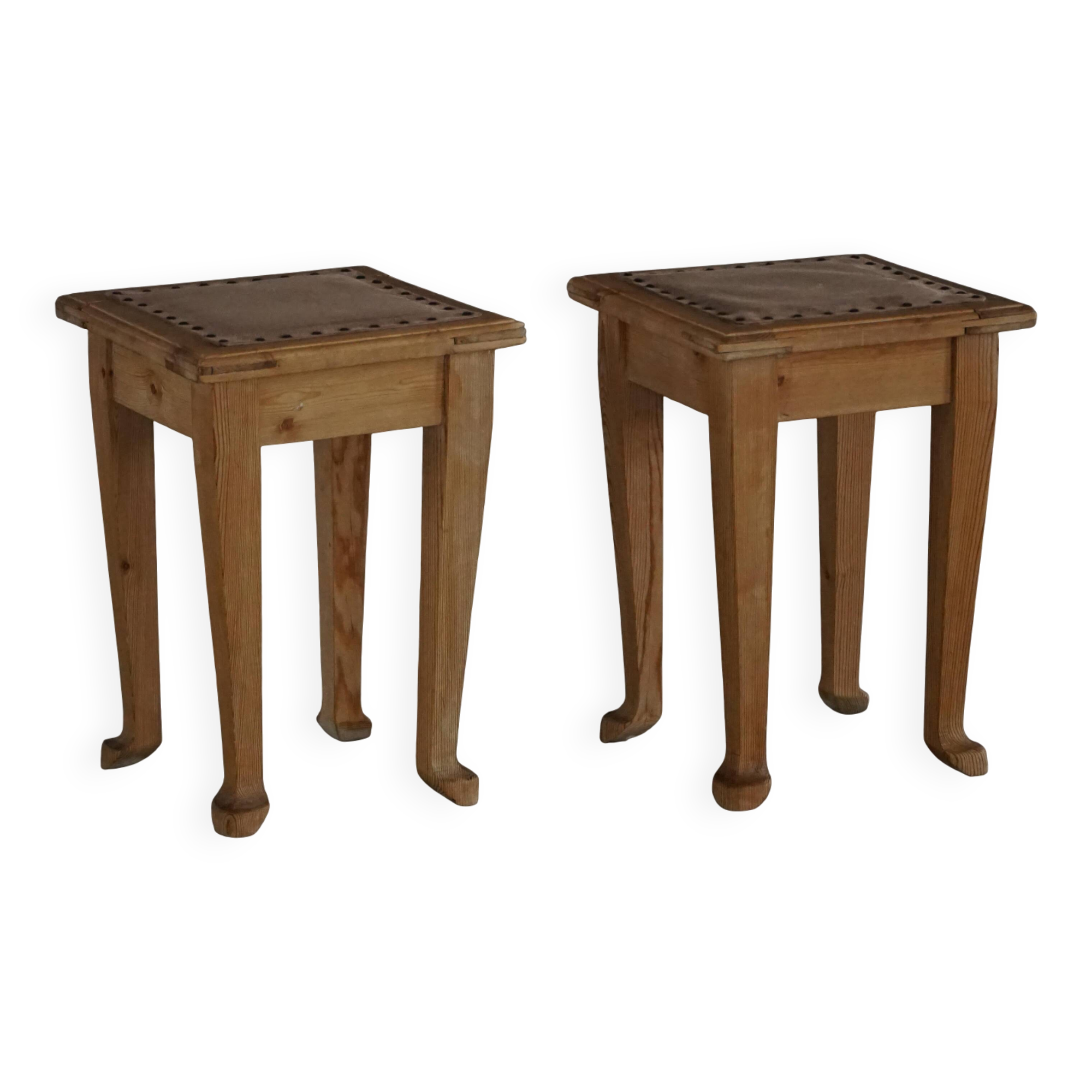 A pair of antique Danish pine stools from the late 19th century.