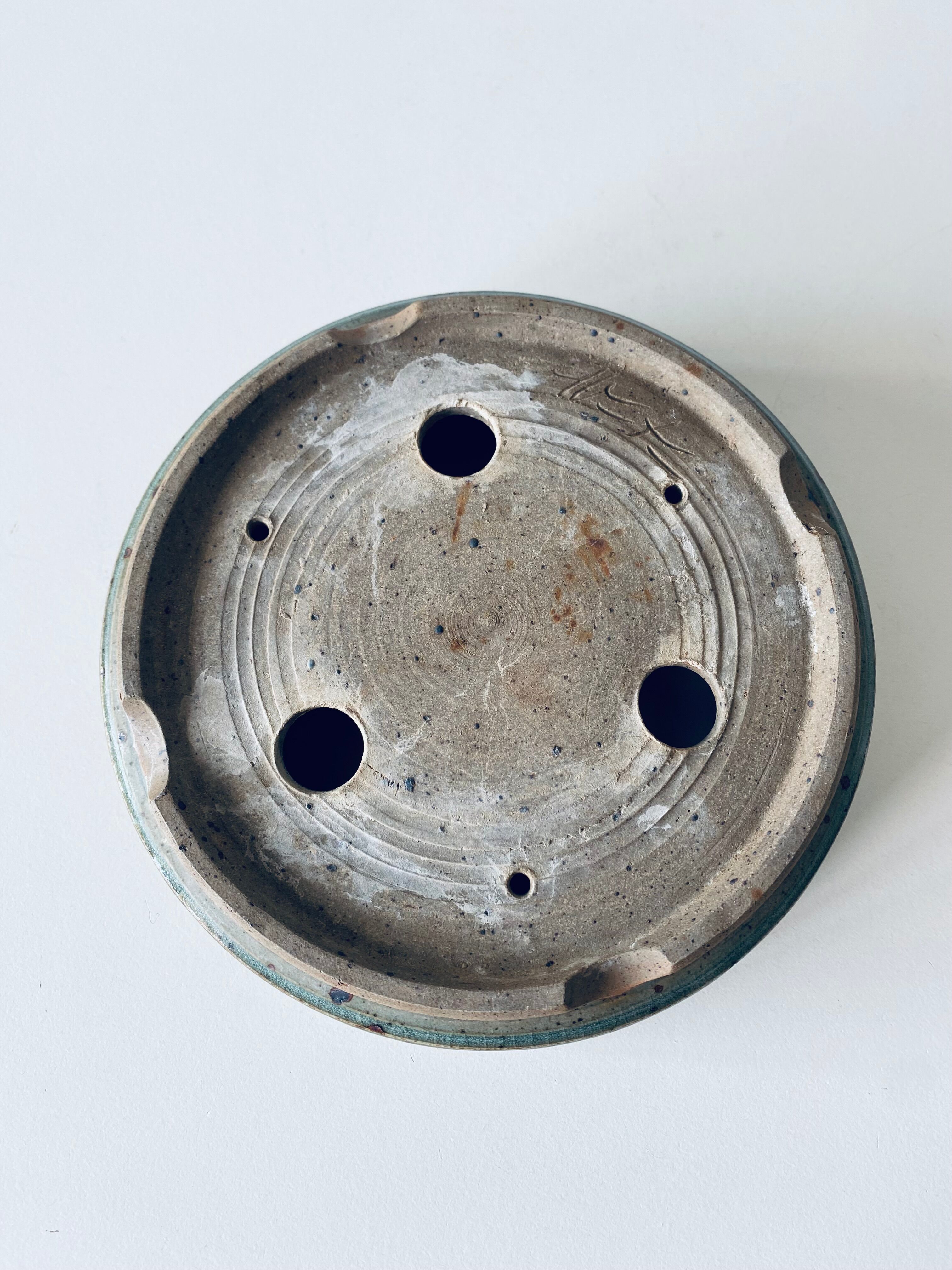 Pierced glazed stoneware cup