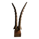 Golden brass sculptural horns on wooden base — modern metal art sculpture, 68.5 cm high