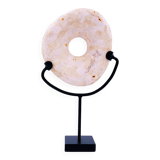 "Wamayuwa" Boiken coin in hand-carved shell mounted on a black metal stand